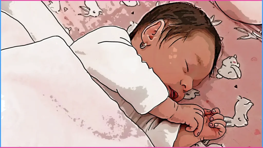 Oldalt fekve alvó baba