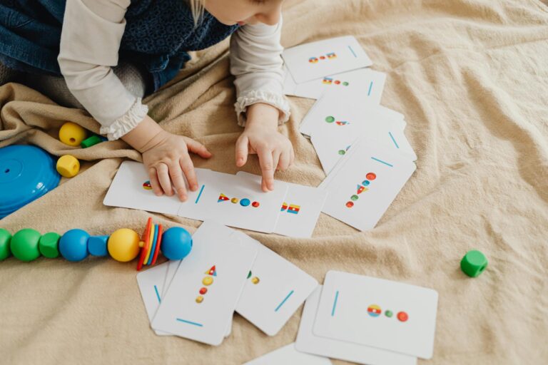A child playing with educational cards and colorful toys, promoting cognitive skills and creativity.