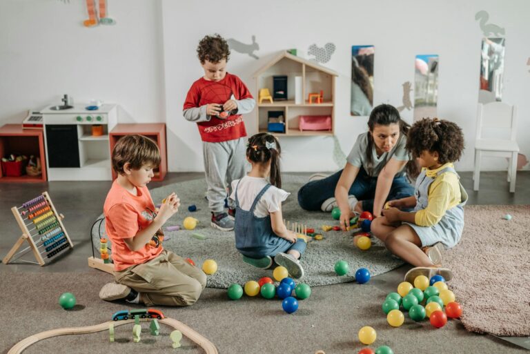 Young children and a teacher engaging in play and learning activities in a preschool setting.